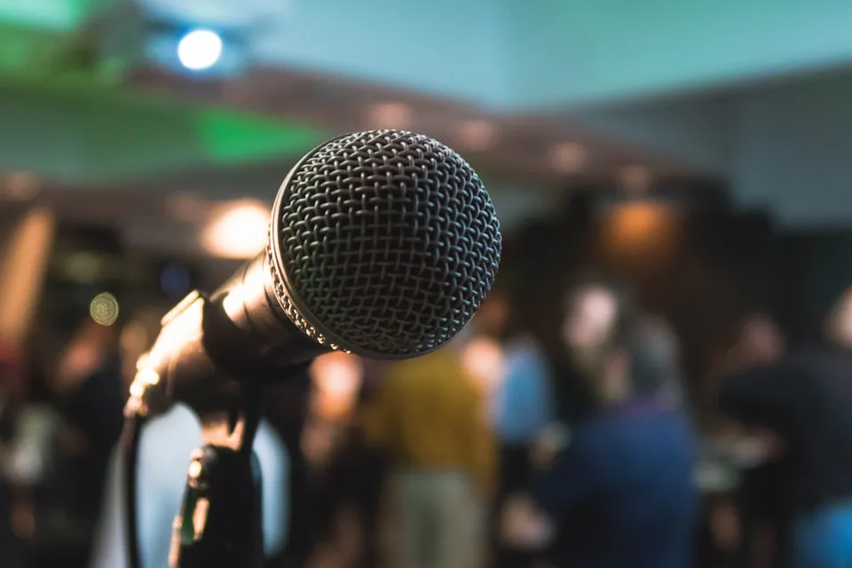 Microphone held up in a crowd
