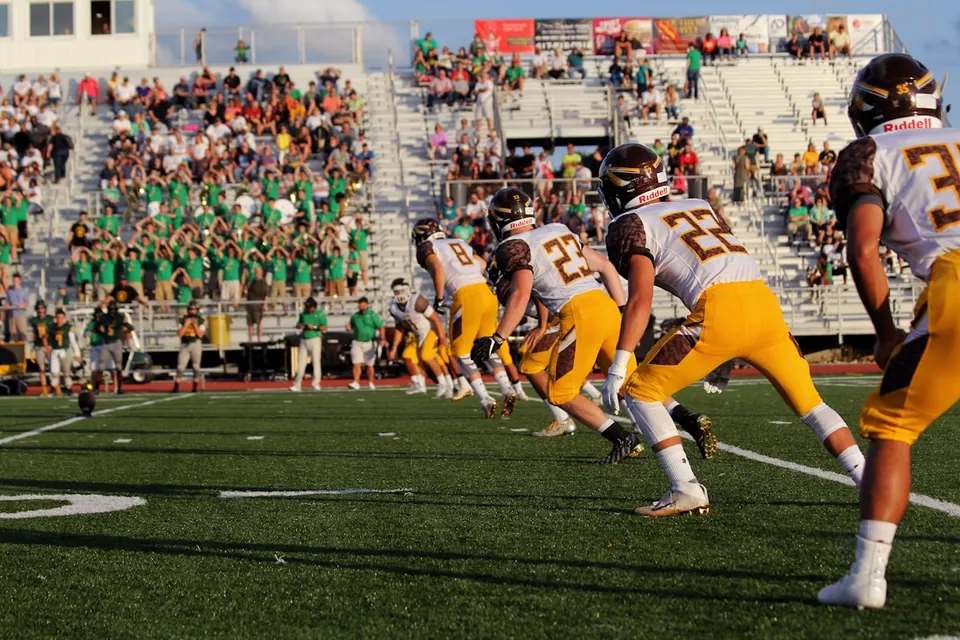High-school football game with the crowd behind